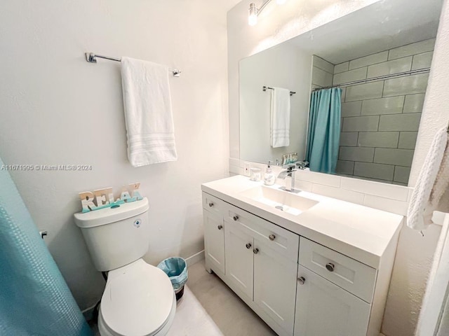 bathroom featuring vanity, a shower with curtain, and toilet