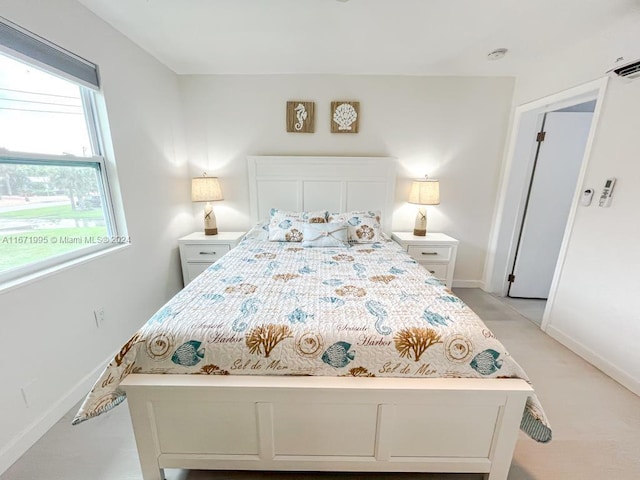 bedroom featuring light carpet