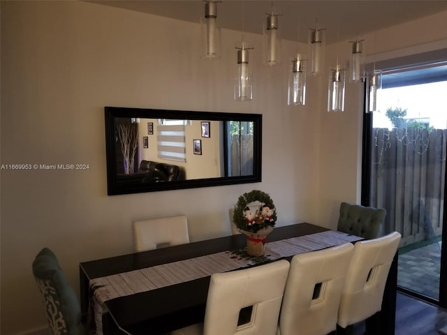 dining space with hardwood / wood-style floors