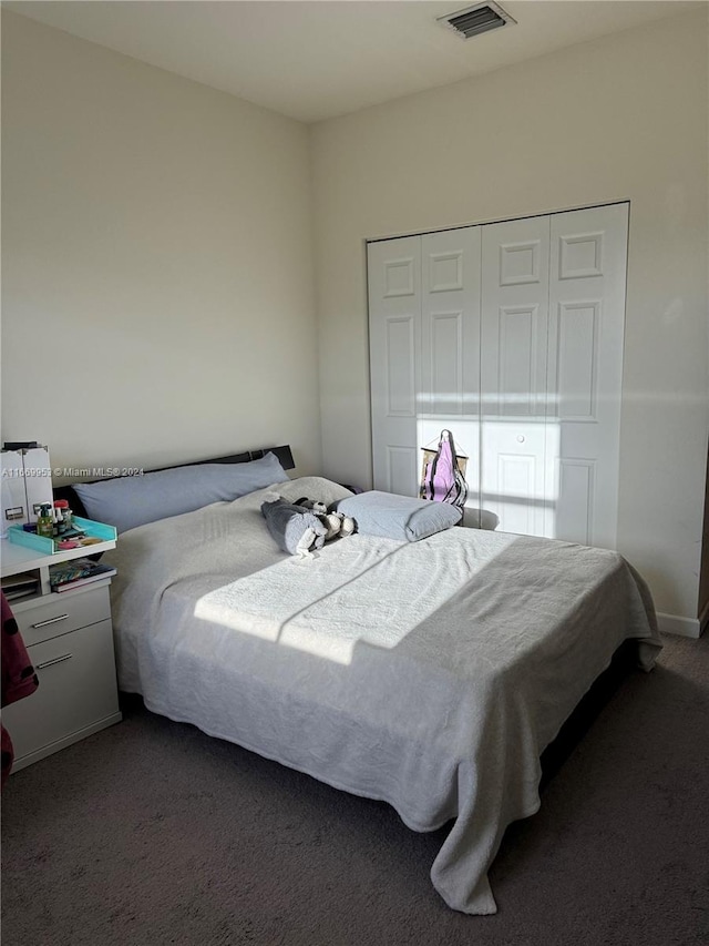 bedroom featuring dark carpet