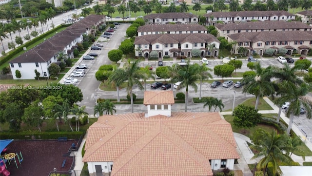 birds eye view of property with a residential view