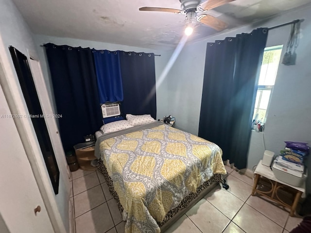 tiled bedroom with ceiling fan and cooling unit