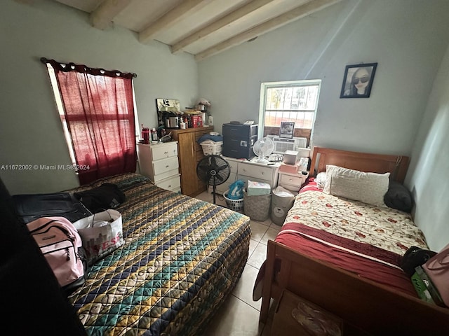 bedroom featuring lofted ceiling with beams and light tile patterned floors