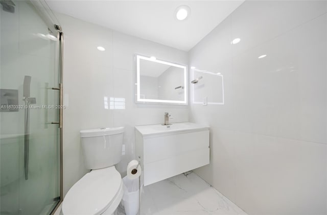 full bathroom with toilet, marble finish floor, a shower stall, and vanity