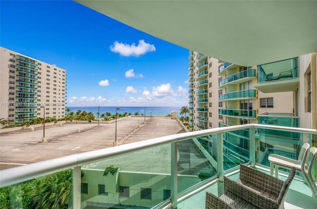 balcony featuring a water view