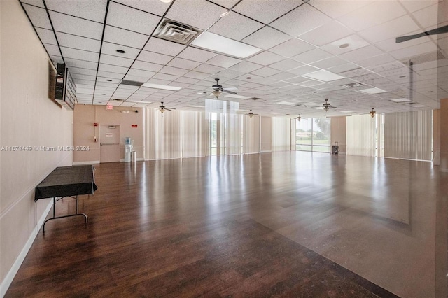 interior space featuring hardwood / wood-style floors, a drop ceiling, and ceiling fan