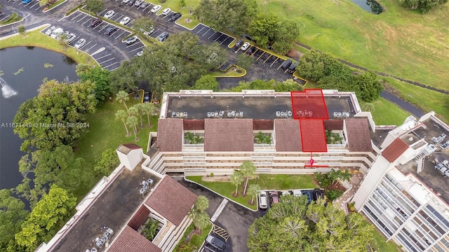 birds eye view of property with a water view