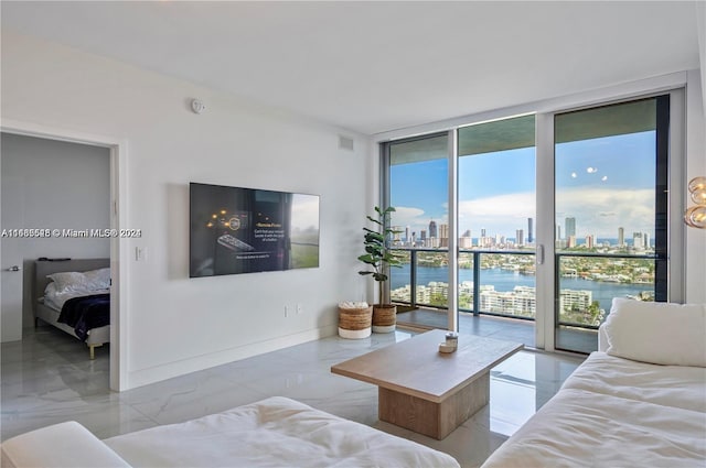 living room featuring a wall of windows