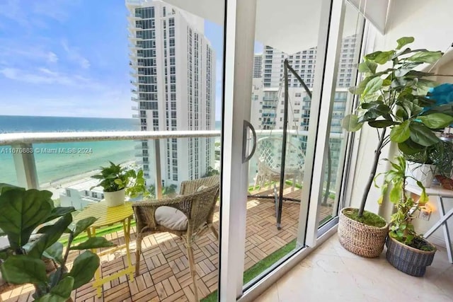 balcony with a view of the beach and a water view