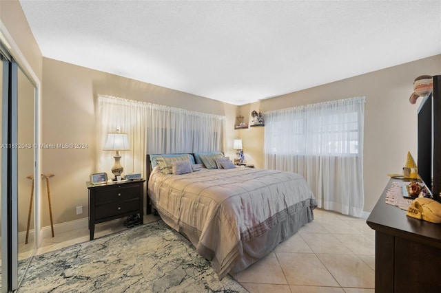 bedroom with light tile patterned flooring