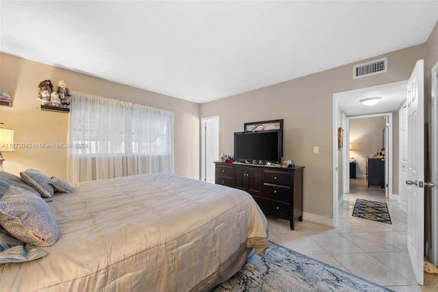 bedroom featuring light tile patterned floors