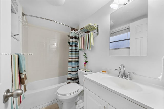 full bathroom featuring tile patterned flooring, vanity, toilet, and shower / bath combo with shower curtain