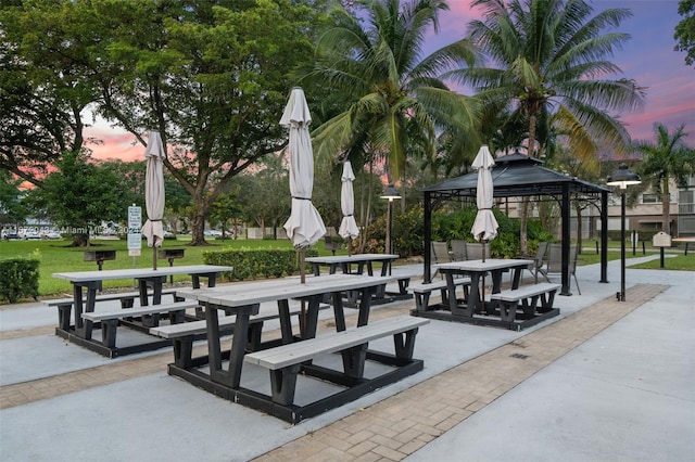 view of property's community with a patio, a gazebo, and a yard