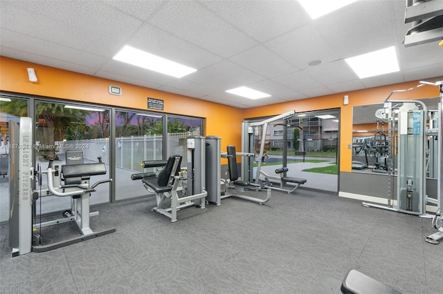 workout area featuring a drop ceiling