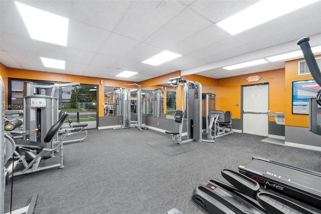 workout area with a drop ceiling