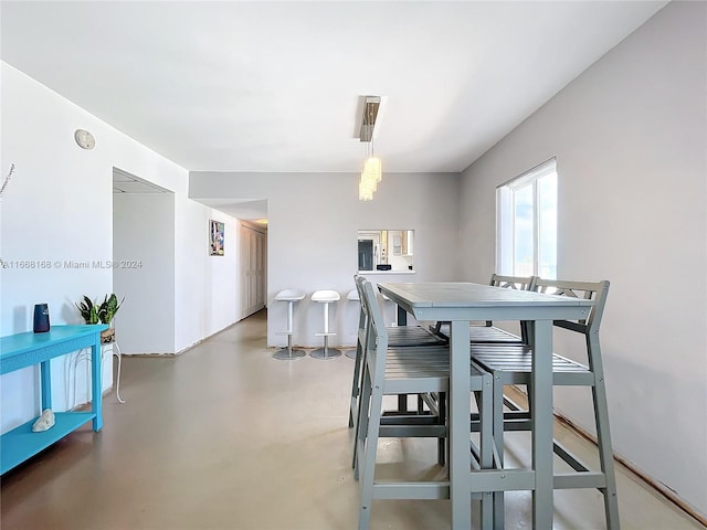 dining room featuring concrete floors