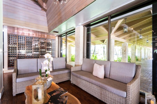 sunroom / solarium featuring lofted ceiling and wooden ceiling