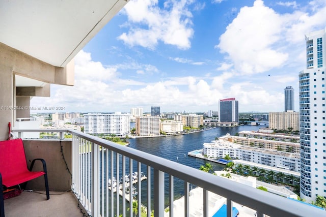 balcony featuring a water view