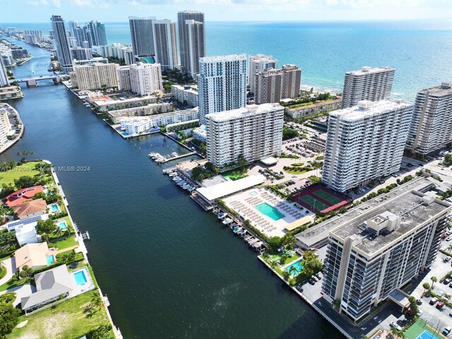 birds eye view of property with a water view