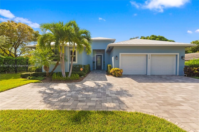 view of front of home with a garage