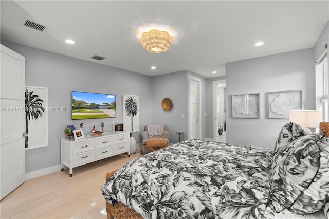 bedroom with light hardwood / wood-style floors