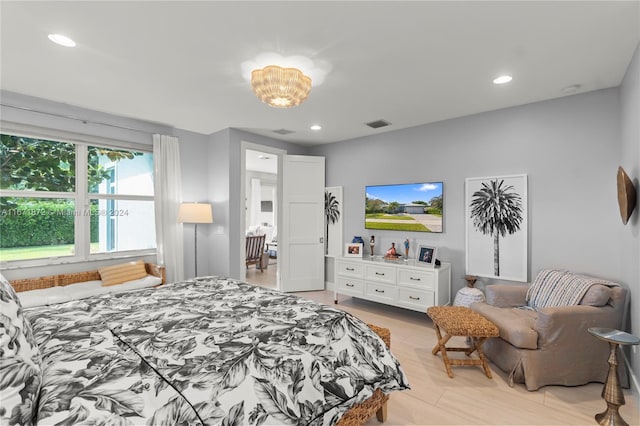 bedroom with light hardwood / wood-style floors