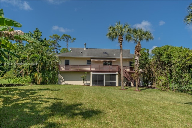 back of house featuring a yard