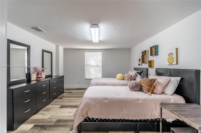 bedroom with light hardwood / wood-style flooring