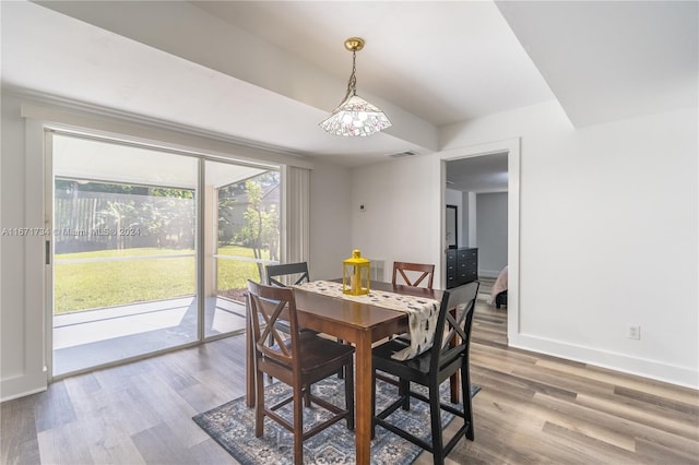 dining space with hardwood / wood-style floors