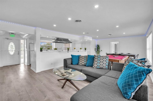 2827 Arthur St, Hollywood, FL 33020 - living area with healthy amount of natural light, wood finished floors, and recessed lighting