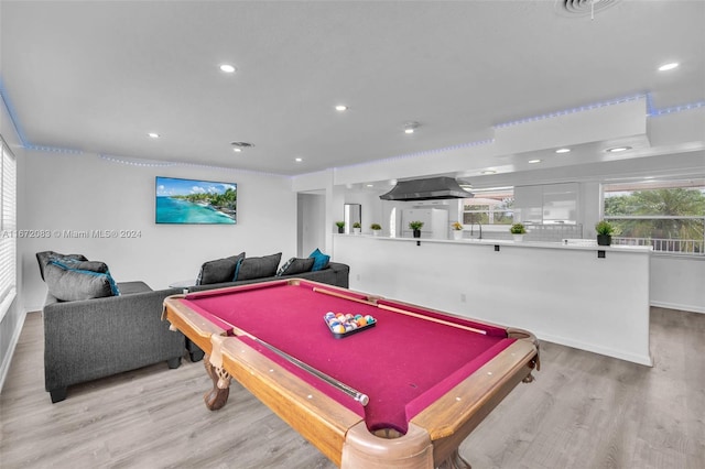 playroom with light hardwood / wood-style flooring and billiards