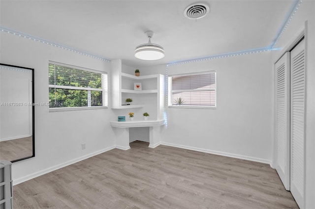 2827 Arthur St, Hollywood, FL 33020 - unfurnished bedroom with multiple windows, wood finished floors, and a closet