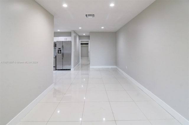 hallway with light tile patterned flooring