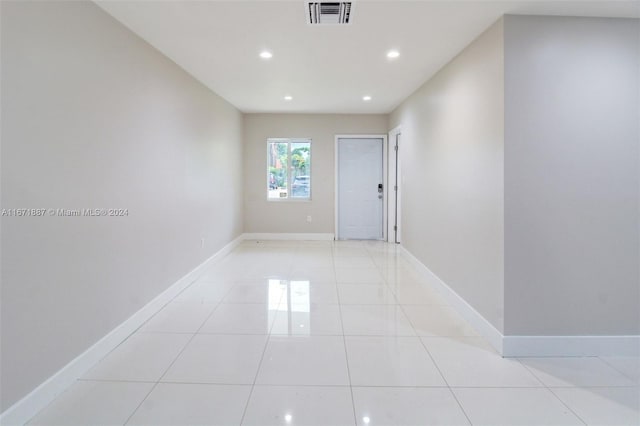 spare room featuring light tile patterned floors