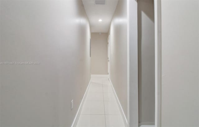 hallway featuring light tile patterned floors