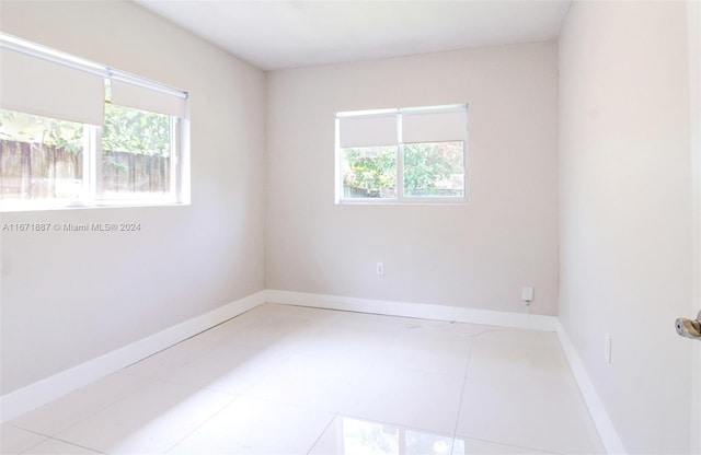 empty room featuring light tile patterned floors