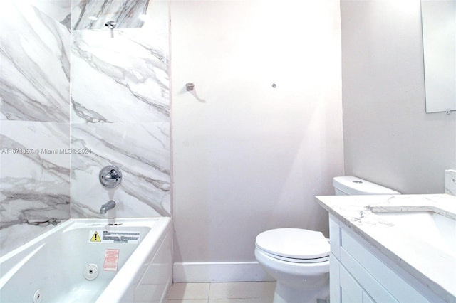 full bathroom featuring tiled shower / bath, vanity, toilet, and tile patterned floors