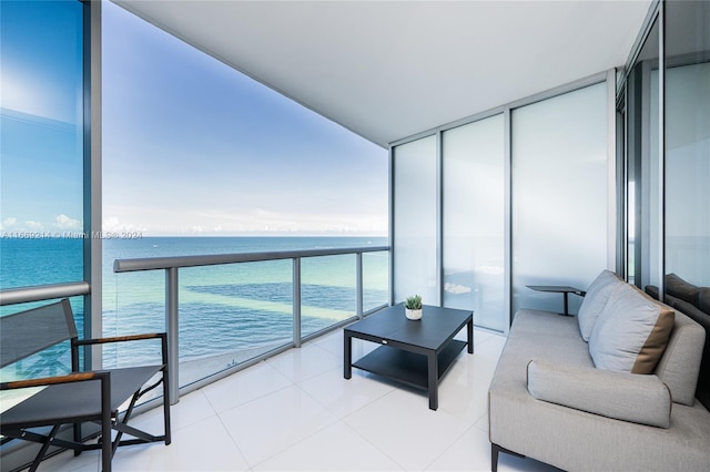 balcony featuring an outdoor hangout area and a water view