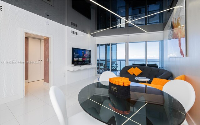 17121 Collins Ave Unit 1103, Sunny Isles Beach, FL 33160 - tiled dining area with a high ceiling