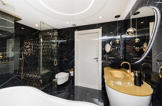 17121 Collins Ave Unit 1103, Sunny Isles Beach, FL 33160 - bathroom with a stall shower, a freestanding tub, marble tiled floors, vanity, and tile walls