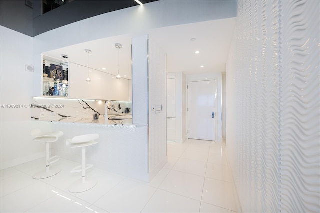 hallway featuring light tile patterned flooring