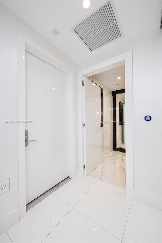 17121 Collins Ave Unit 1103, Sunny Isles Beach, FL 33160 - corridor featuring light tile patterned floors and recessed lighting