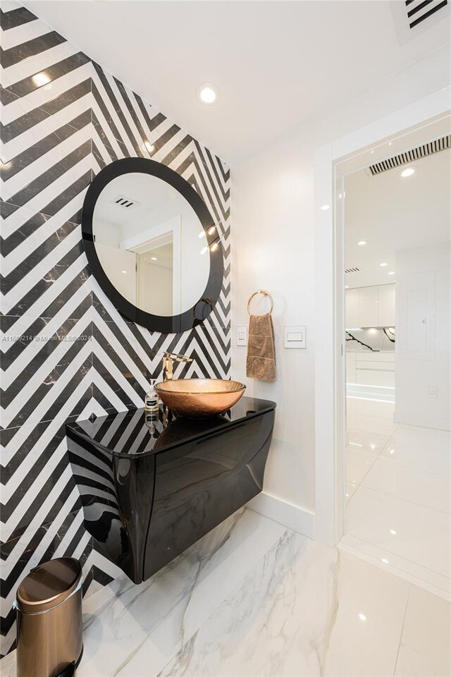 17121 Collins Ave Unit 1103, Sunny Isles Beach, FL 33160 - bathroom with vanity, marble finish floors, recessed lighting, and baseboards
