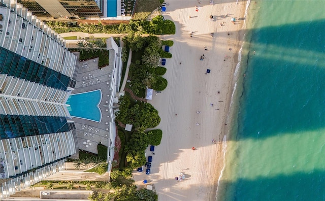 bird's eye view with a water view and a view of the beach