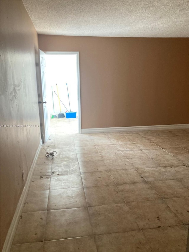 hallway with a textured ceiling