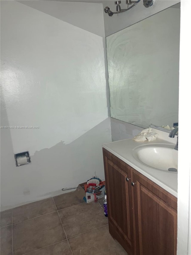 bathroom with tile patterned flooring and vanity