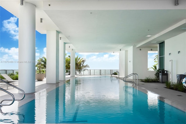 view of swimming pool featuring a patio area