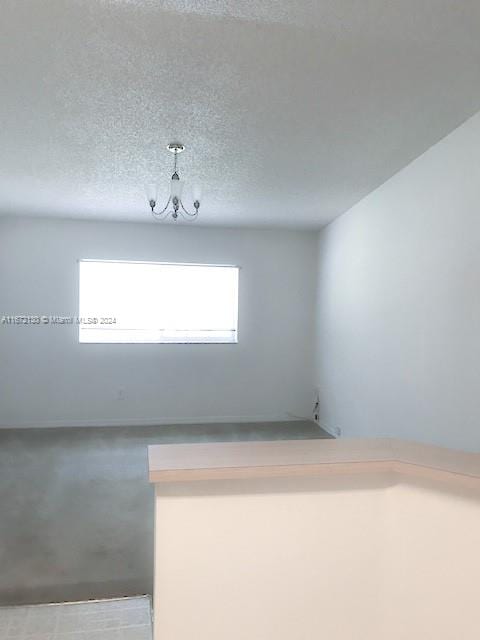 empty room featuring a textured ceiling