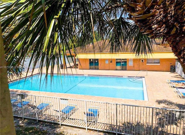 view of swimming pool featuring a patio area