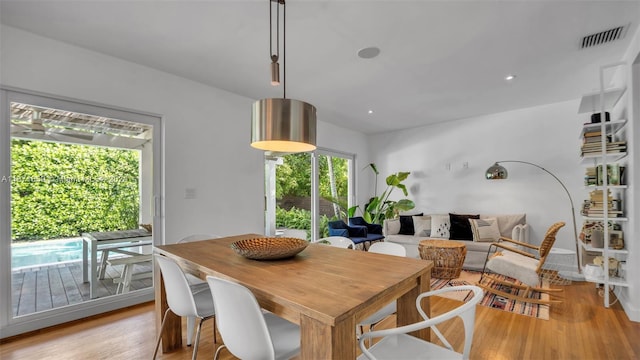 dining room with light hardwood / wood-style flooring